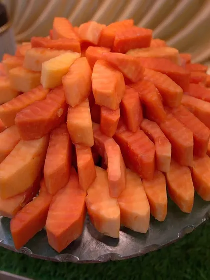 Freshly cut papaya sticks, beautifully arranged and ready to be served.