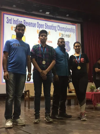 My students on stage after winning medals at the 3rd Indian Revenue Open Shooting Championship in 2019.