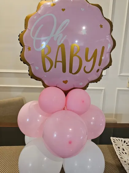 A simple yet sweet 'Oh Baby!' balloon bouquet in pink and white. Perfect for a small baby shower or as an add-on to a larger decor setup.