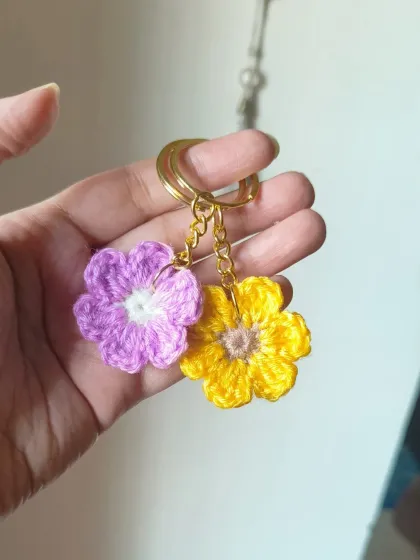 A pair of our pastel floral keychains, one in lilac and one in yellow. They make a wonderful and affordable gift set.