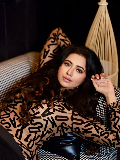 A close-up beauty shot of Ridhima Tiwari. This highlights the soft glam makeup, with a focus on beautifully blended eyeshadow and a neutral lip.