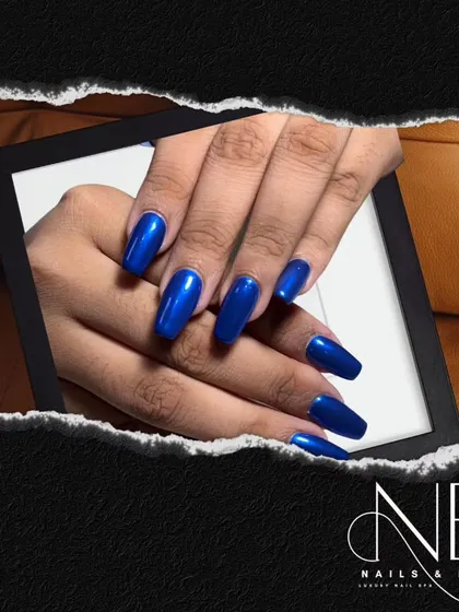 A stunning, electric blue. This set features a full-coverage, glossy cobalt polish on long, square-shaped nails for a simple but incredibly bold statement.