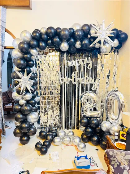 Another angle of the glamorous black and silver 20th birthday setup.