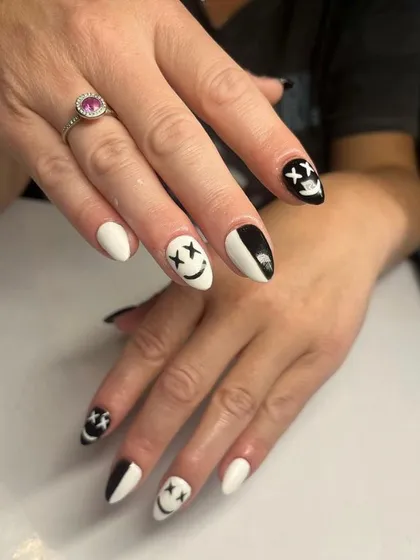 A quirky and edgy black and white design featuring smiley and sad faces with 'X' eyes.