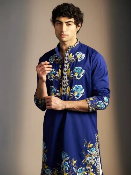 A closer look at the artistic details on the blue kurta.