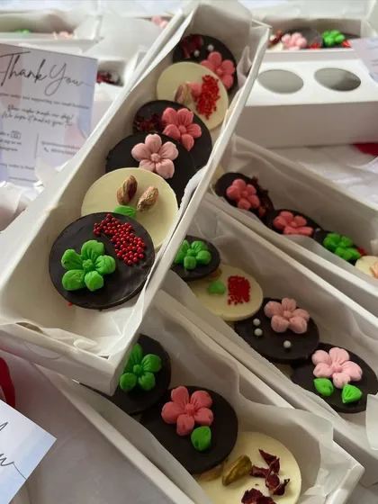 A closer look at the floral and heart designs on my Valentine's chocolate discs. I use both dark and white chocolate to create a beautiful and tasty assortment.