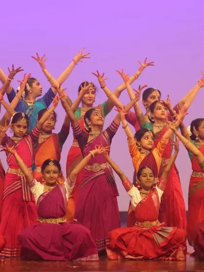Our junior Bharatanatyam students in a beautiful group formation at SparkLights 2024. This image represents the culmination of their dedication and the strong sense of community they build together.