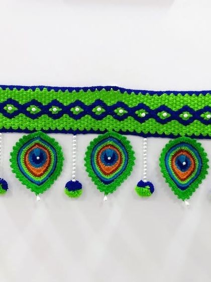 The full length of a standard peacock toran, a truly eye-catching piece for your home decor.