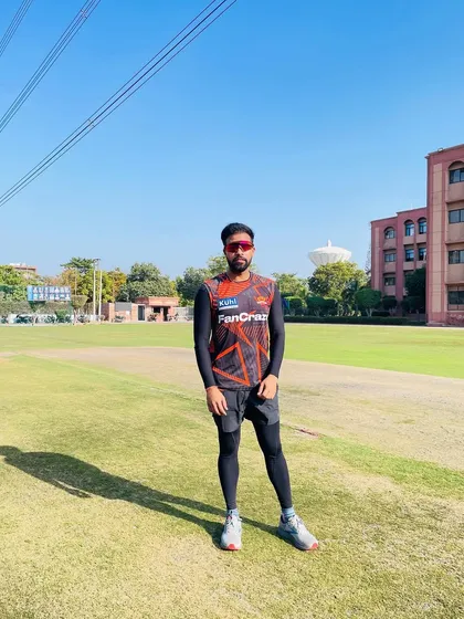 Facing the camera on the training ground. It's about being present, focused, and ready to lead the team through their conditioning work.