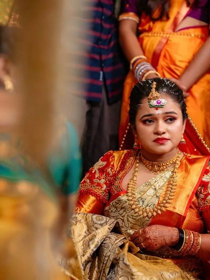 A candid shot of a bride during a quiet moment in the wedding ceremony. We capture the full range of emotions, from joyful to contemplative.