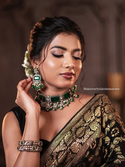 A close-up portrait of the simple makeup look, highlighting the glowing skin and defined eyes.