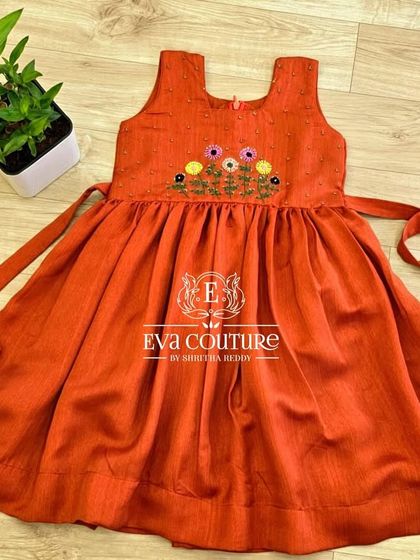 A simple and comfortable rust-colored cotton frock with floral embroidery, available in my ready stock.