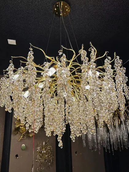 A closer look at one of our grand crystal chandeliers. This piece is perfect for double-height areas or large living rooms, designed to capture and reflect light for maximum sparkle and impact.