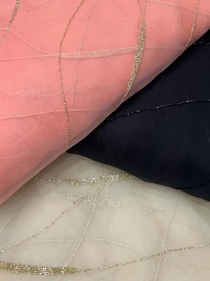 Here you can see the versatility of my embroidered organza. Available in soft pink, classic navy, and off-white, the delicate silver beading provides a subtle shimmer suitable for both day and evening wear.