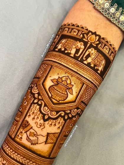 A close-up of a bridal arm design showing the 'hathleva' ceremony and a sacred kalash. These elements are surrounded by auspicious elephants and swans.