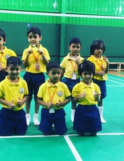 A happy team of young players after a great session. I strive to create a positive and encouraging environment where kids can build friendships and share their passion for badminton.