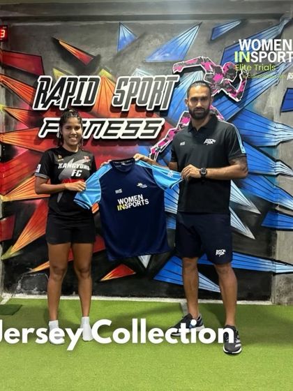 A female footballer receives her jersey at the start of the Elite Trials camp. This moment signifies the beginning of an intensive journey toward securing a professional contract abroad.