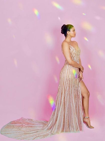 Actress Daisy Shah in a beautiful beaded gown against a soft pink background. I used a prism effect to create rainbow light flares, adding a magical quality to this Filmfare-ready look.