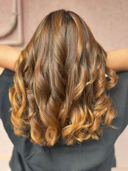 The back view of this 'Golden Hour' hair. The warm honey blonde tones are rich and vibrant, all achieved without bleach.