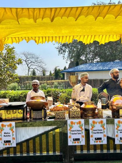 Another view of the food stalls at a sunny Holi party. This counter served a variety of traditional snacks like Matra Kulcha and Kachori tarts.