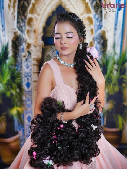 This pose highlights the sheer volume and length of the hair, the defining feature of this look.