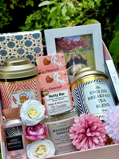 A personalized hamper to make her feel truly special. This gift includes Sancha teas, a custom photo frame, a Bath & Body Works candle and shower gel, and a YSL pocket perfume.