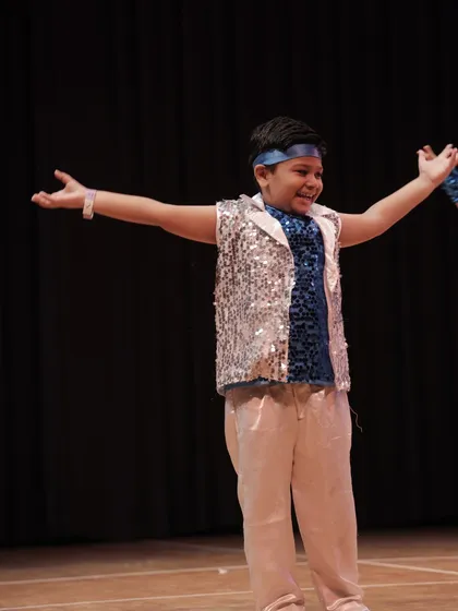 Pure joy and expression. This student's open arms and happy face embody the spirit of our 'Thirkan' showcase.