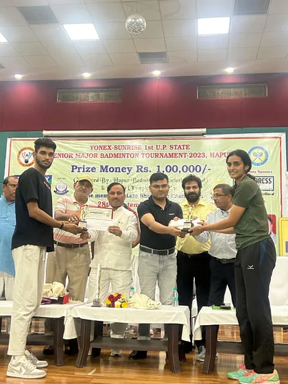 My athletes receiving their gold medals for Mixed Doubles at the prize distribution ceremony of the Yonex UP Senior State Tournament.