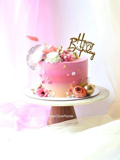 Another shot of the elegant floral cake, capturing its soft and celebratory feel.