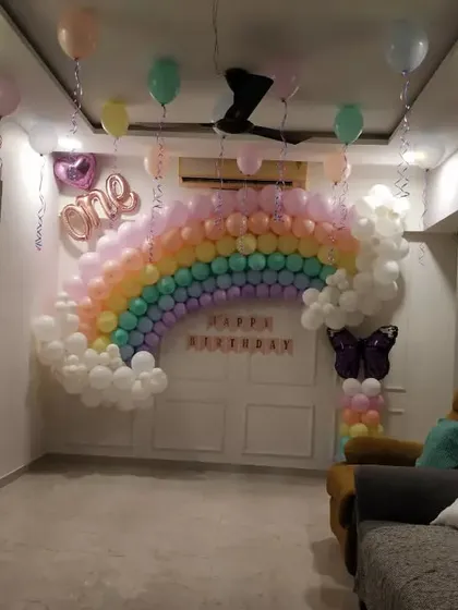 A wide shot of the living room with the pastel rainbow theme, demonstrating how the decor works within the space.