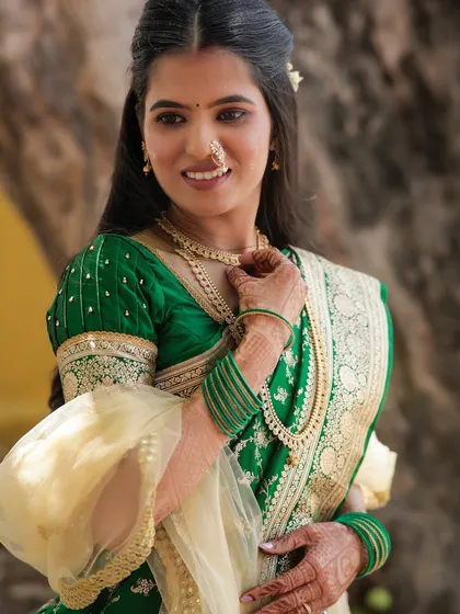 A close-up of the bride, showing the soft makeup and half-up, half-down hairstyle.