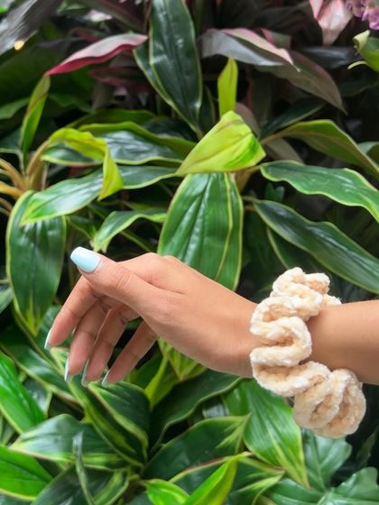 This beige velvet scrunchie is a perfect neutral accessory. The color is subtle and elegant, and the plush texture feels luxurious.