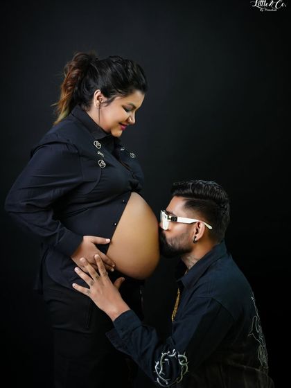 A classic pose of a father-to-be kissing the baby bump. This shot beautifully captures his love and excitement for the new arrival in a simple, modern style.