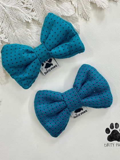 These teal polka dot bows are part of my summer sale. They are handcrafted and perfect for adding a pop of color to your pet's look.