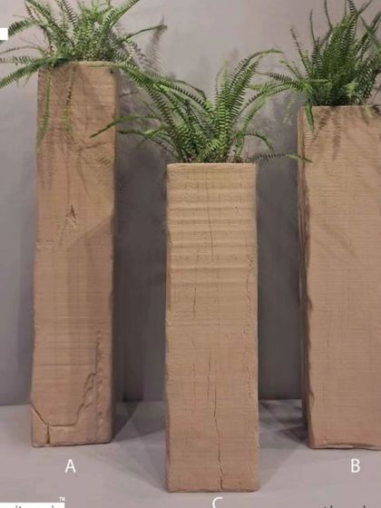 Tall, rustic planters that mimic the look of old wooden railway sleepers, perfect for an industrial or rustic aesthetic.