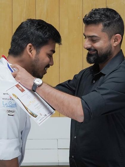 Our chef awarding a medal to a student who competed in the Mondial Du Pain, the world championship of bread baking.