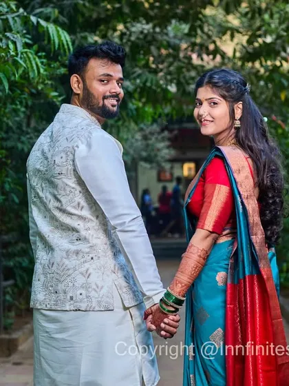 A playful and candid "follow me" style shot of a couple during their engagement event. This captures a natural interaction and is perfect for telling the story of your journey together.