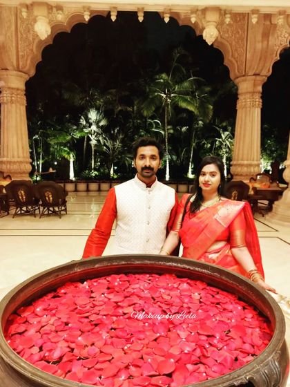 A couple enjoying their anniversary celebration at a beautiful venue. The client's makeup is elegant and suitable for a romantic evening out.