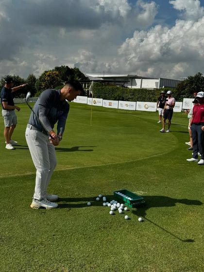 A coach demonstrates a chipping technique during a seminar. We focus on mastering the details that make a difference at the highest levels.