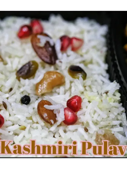 A rich and flavorful Kashmiri Pulao, loaded with dry fruits and pomegranate, served as part of a Thursday happy meal.