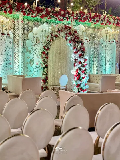A view from the guest seating, showing the beautiful stage and the elegant arrangement of chairs for the attendees.