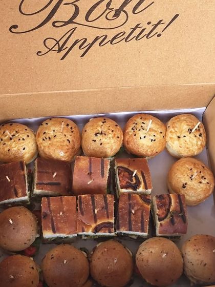 Another look at our popular canapés box, filled with mini sandwiches and burgers. It's the ultimate way to experience gourmet goodness in every bite, delivered right to you.