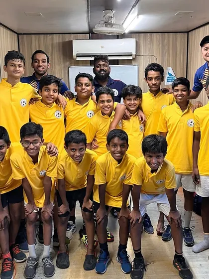 The U-13 team celebrating in the locker room after their 2-1 win. The joy and camaraderie are what make these victories so special.