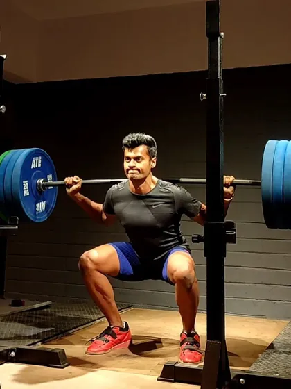 A heavy squat session under the lights. The focus here is on maintaining perfect form under a heavy load, which is the cornerstone of my training philosophy.