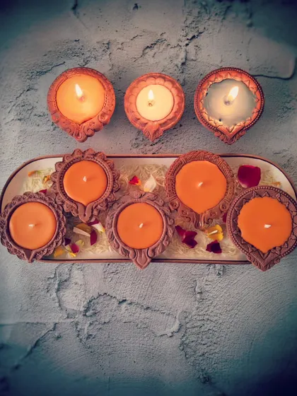 Another arrangement of my Diya Candles, showing the vibrant saffron color. These are perfect for creating a powerful and unified energy to celebrate joyous occasions like the homecoming of Shree Ram.