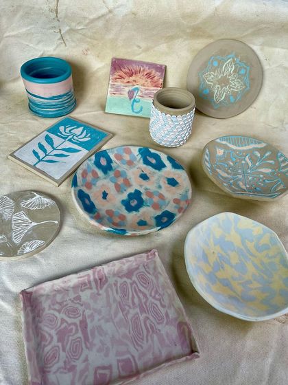 A duplicate of image 13, showcasing the colorful and diverse results from our workshops. These pieces are all food-safe, microwave-safe, and ready to be used and loved.