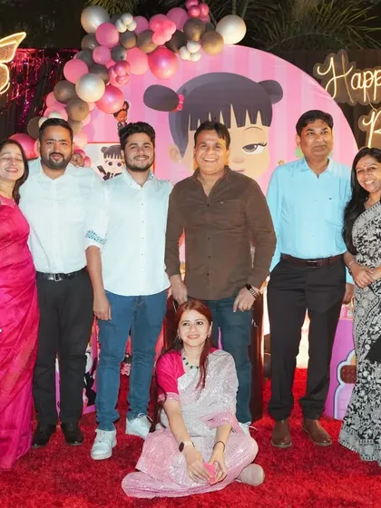We make sure to get great shots of all your friends and family. This is a happy group photo of the guests enjoying the celebration at Raavi's birthday party.