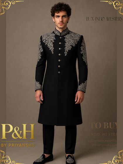 This black Indo-Western suit is the epitome of timeless elegance. I used contrasting silver hand-embroidery on the collar, shoulders, and cuffs to create a striking design that is both classic and powerful.