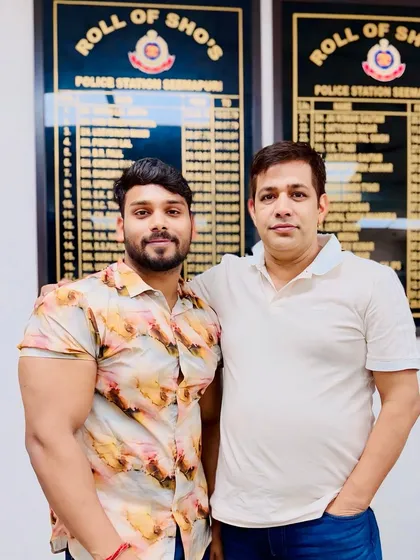 Pictured with an officer at the Seemapuri Police Station. My familiarity with the personnel and procedures at local stations is an asset in my criminal defense practice.