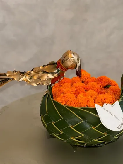 The Diwali season is here. This simple, elegant arrangement features a bowl of auspicious marigolds woven from palm leaves, accented with a golden bird. It's a beautiful reminder of gratitude, love, and respect for tradition.